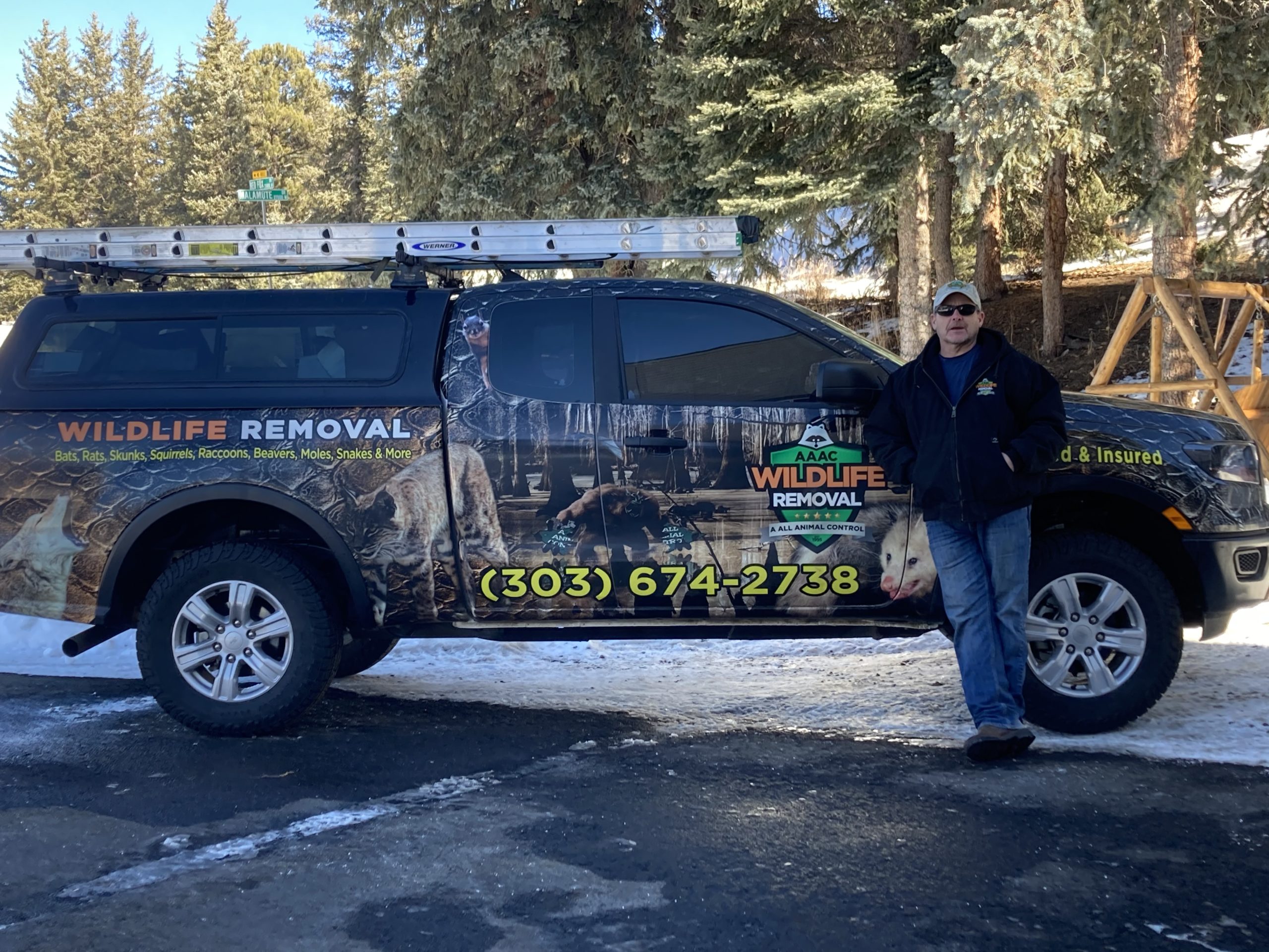 AAAC Wildlife Removal Owner, Dean Grose, standing in front of his wildlife removal truck